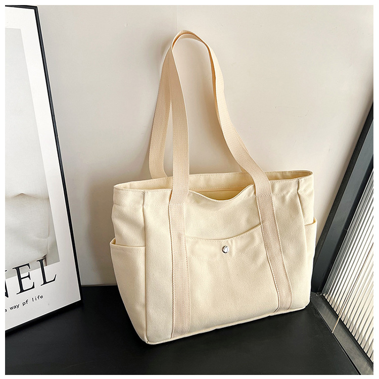 Wholesale of new women's single-shoulder bags, cross-border simple and casual canvas bags, Korean version LOGO printed commuter tote bags undefined