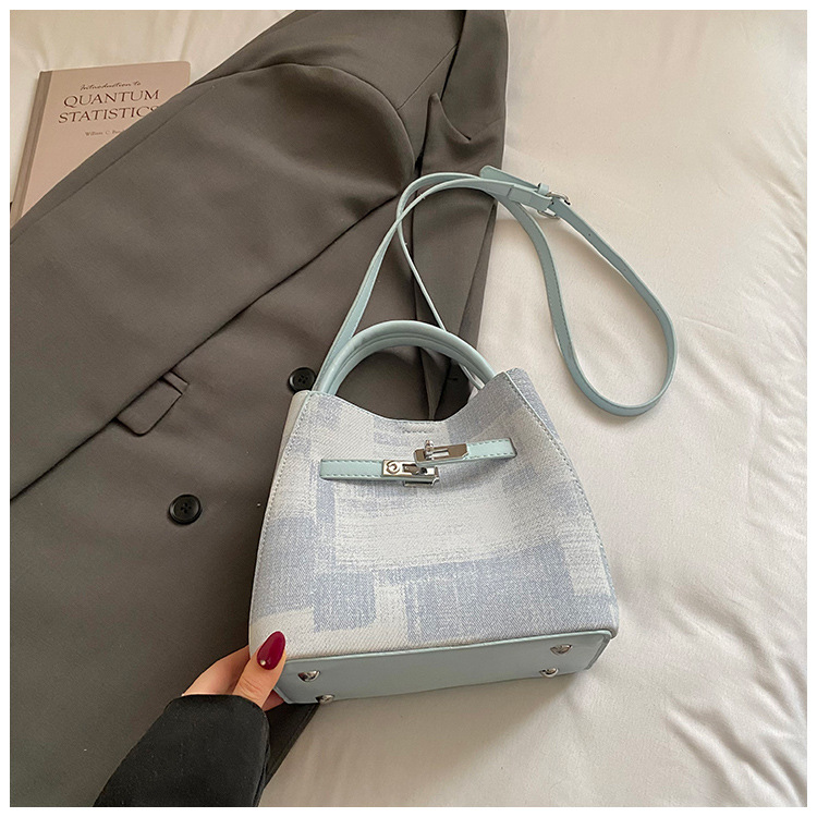 Comercio exterior transfronterizo coreano simple nicho de diseño de moda bolso de cubo para mujeres 2026 nuevo tipo de mujer mochila de hombro