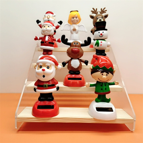 Cross-border Christmas solar-powered automatic swinging doll car shaking head decoration creative car car ornaments