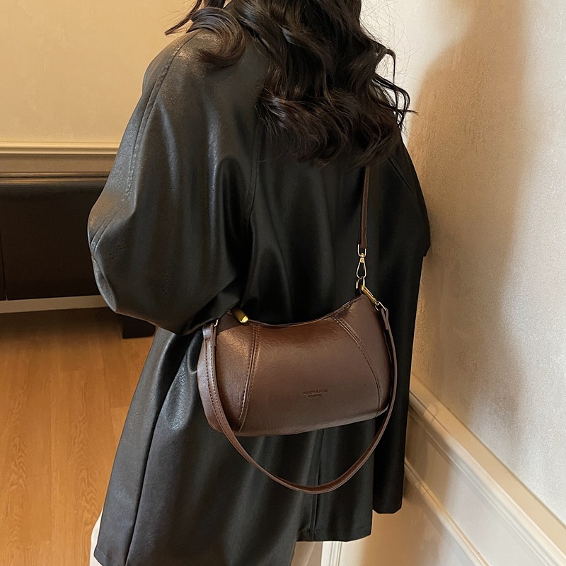 Bolso de viaje de nicho coreano para mujeres otoño / invierno 2025, nuevo estilo de moda retro bolso de hombro simple mochila casual