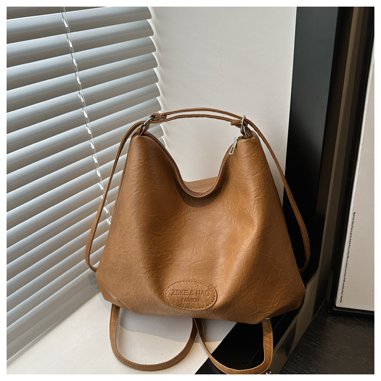 The 2024 new pleated tote bag is a large-capacity casual and fashionable backpack for women, featuring multi-functional texture and a single-shoulder crossbody bag undefined