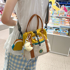 2025 新かわいいコントラストカラーショルダークロスボディバッグ女性のポータブルバケツ小さなバッグ夏のカジュアル通勤携帯電話バッグ