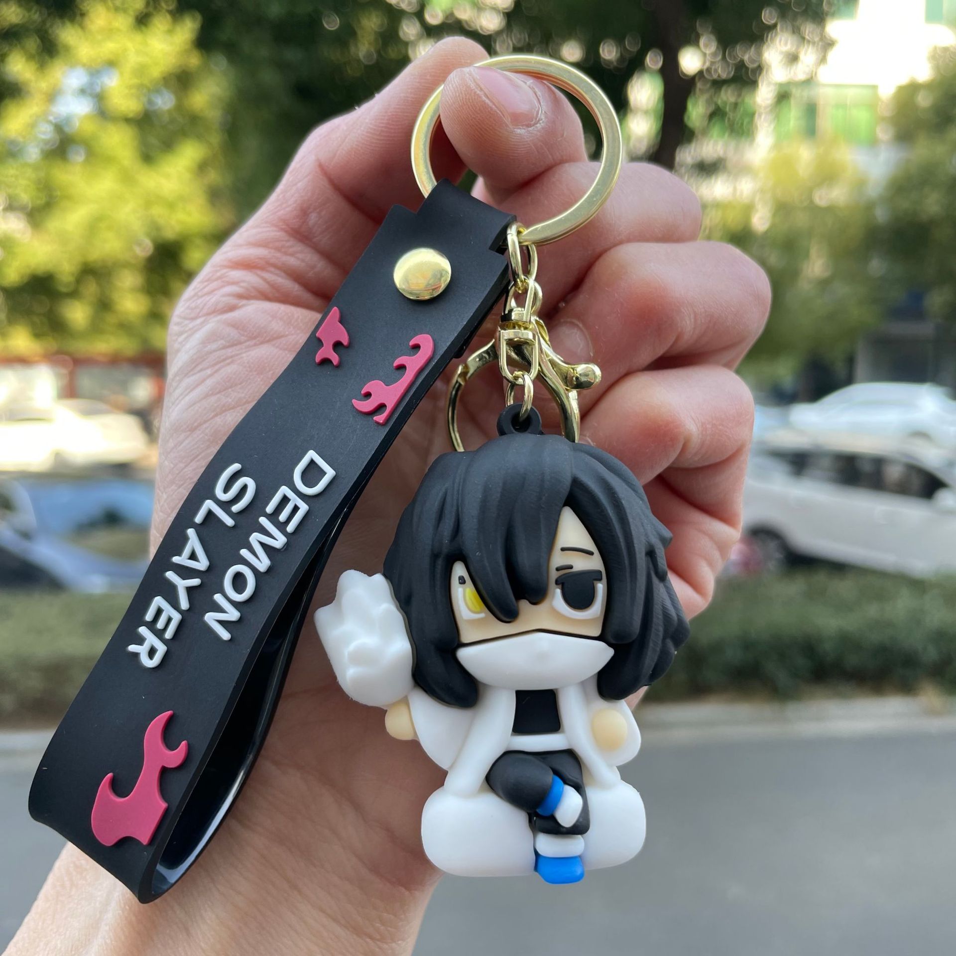 鬼滅の刃の鍵は自動車のキーチェーンの漫画の公仔のかばんのペンダントの子供機の小さい贈り物の卸売りを掛けます。