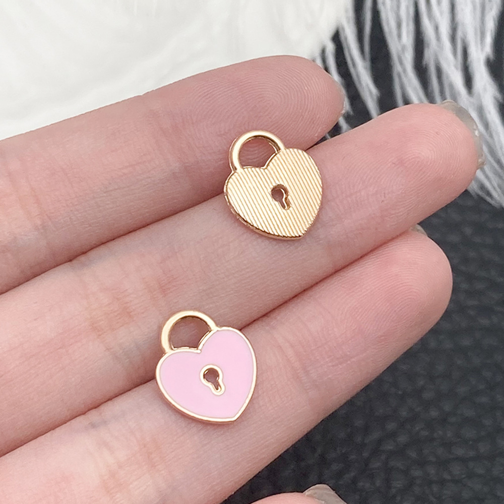 1 cerradura en forma de corazón de melocotón rosa 11x13mm - 14361 - 0,5g