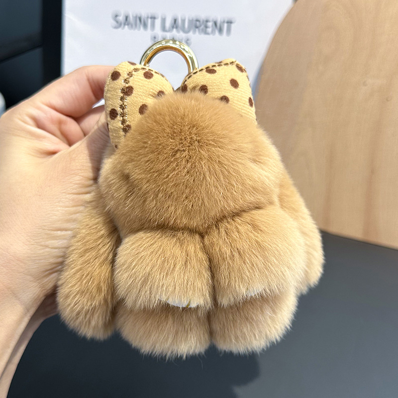 卸売りのかわいいウサギの毛の蝶結びの小さいウサギの自動車のキーホルダーはぬいぐるみのかばんを掛けて飾ります。