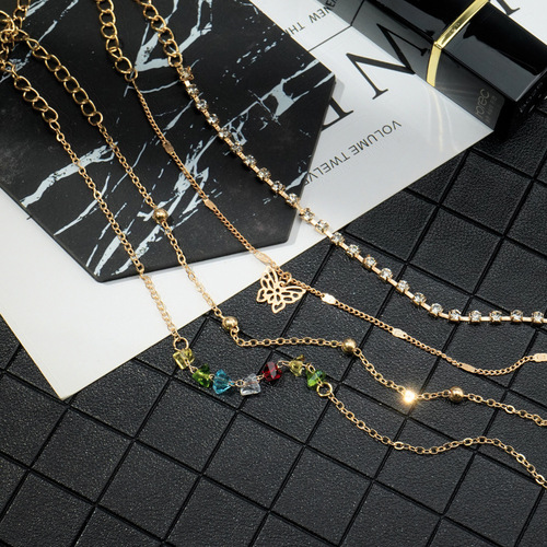 Korean-style Jewelry on AliExpress: Hot-selling 4-Piece Set of Retro Colorful Rhinestone Butterfly Multi-layer Anklets—Perfect Beach Foot Accessories for Europe and America