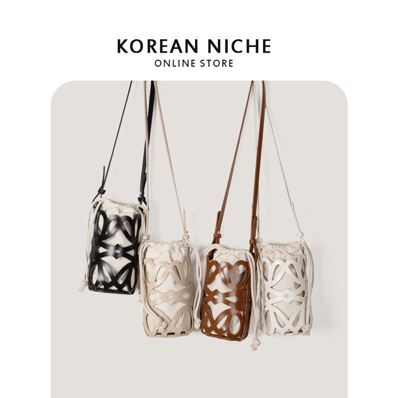 Bolso de mujer 2022 nuevo diseño de nicho hueco cordón lienzo cilindro pequeño bolso personalizado retro crossbody bolso de hombro