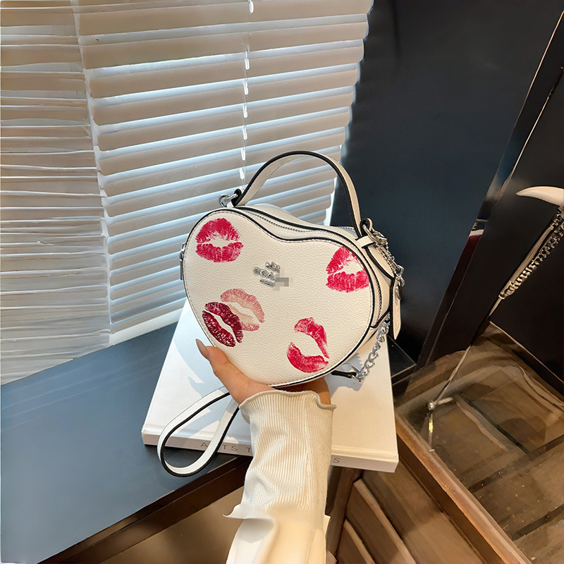 Bolso de mano en forma de corazón de comercio exterior, bolso de hombro de impresión de moda creativa, bolso de hombro simple, bolso de hombro de dama de Europa y América.