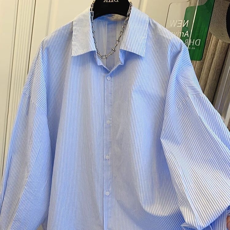 Blue Striped Sun-Protective Fashion Shirt with a Stylish Design, Loose Fit, Long Sleeves, and a Unique Cut-Out Style Blue Striped Sun-Protective Fashion Shirt with a Stylish Design, Loose Fit, Long Sleeves, and a Unique Cut-Out Style