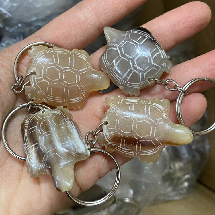 牛の角の丈夫で丈夫なキーホルダー車のロックは生肖の小動物の牛の角の製品の工芸品の車のアクセサリーを掛けます。|undefined