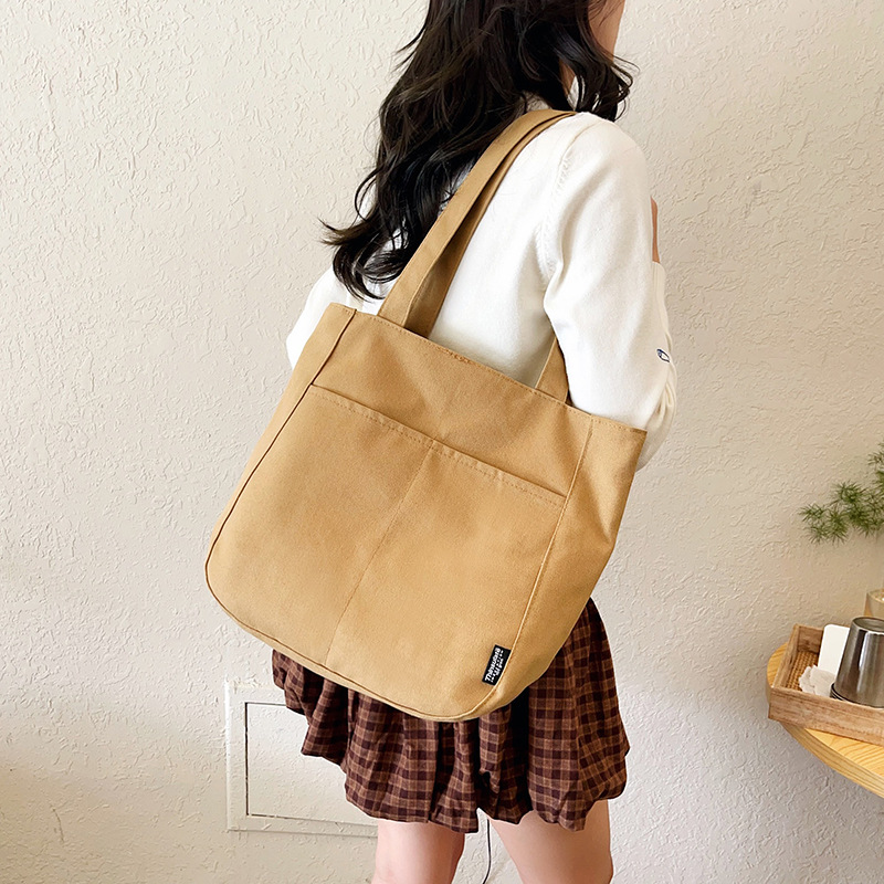 包包女2025新款单肩包女士通勤帆布包潮大容量时尚百搭托特包批发