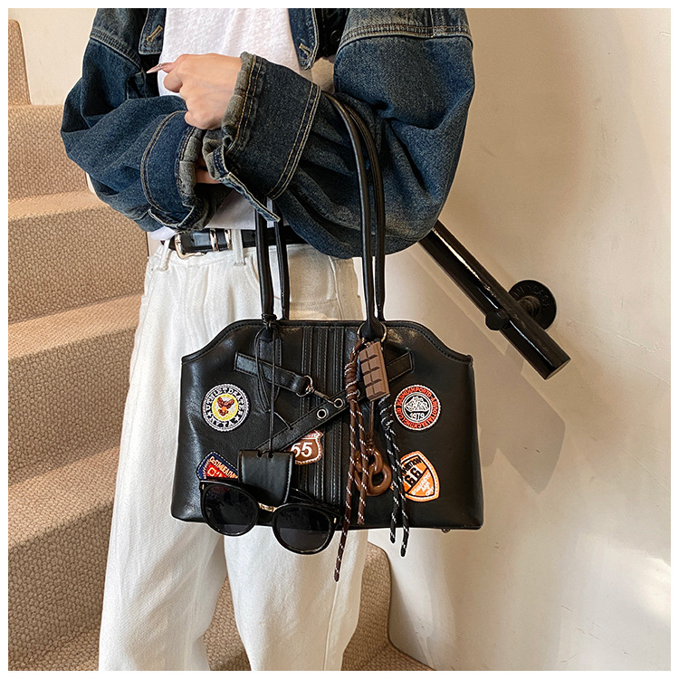 Insignia retro de gran capacidad hombro brazo bolso para mujeres 2025 nueva moda transfronteriza alta textura bolso