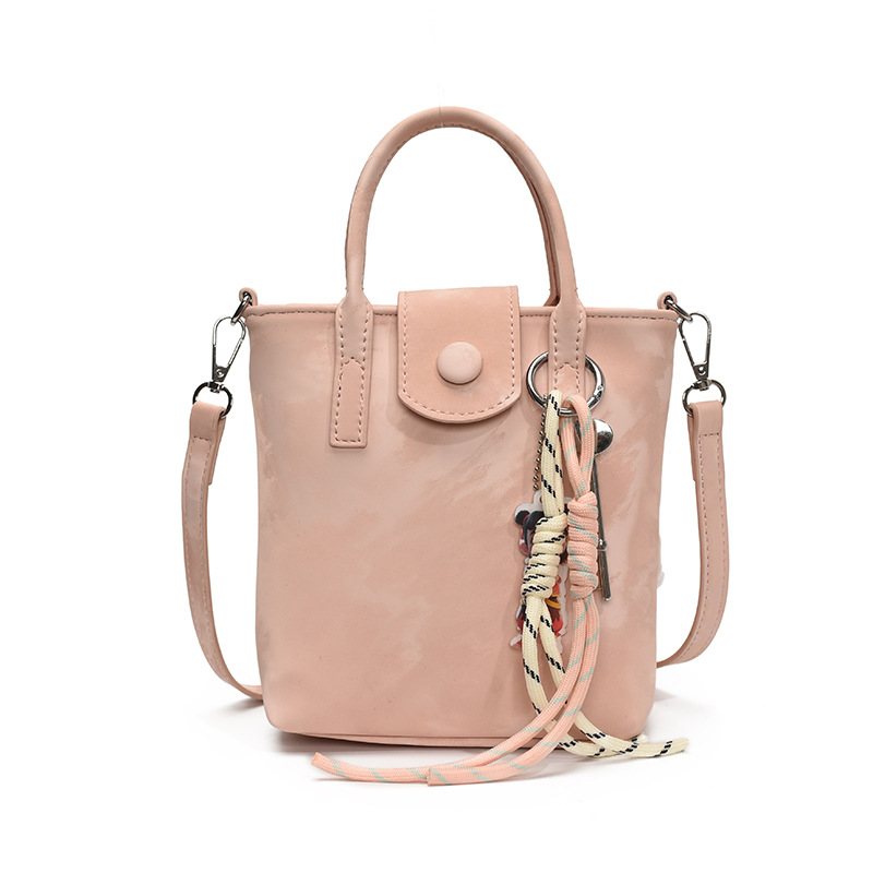 Verano super caliente mini bolso de mano para mujeres 2025 nueva moda bolso de balde de moda explosión de textura universal mochila