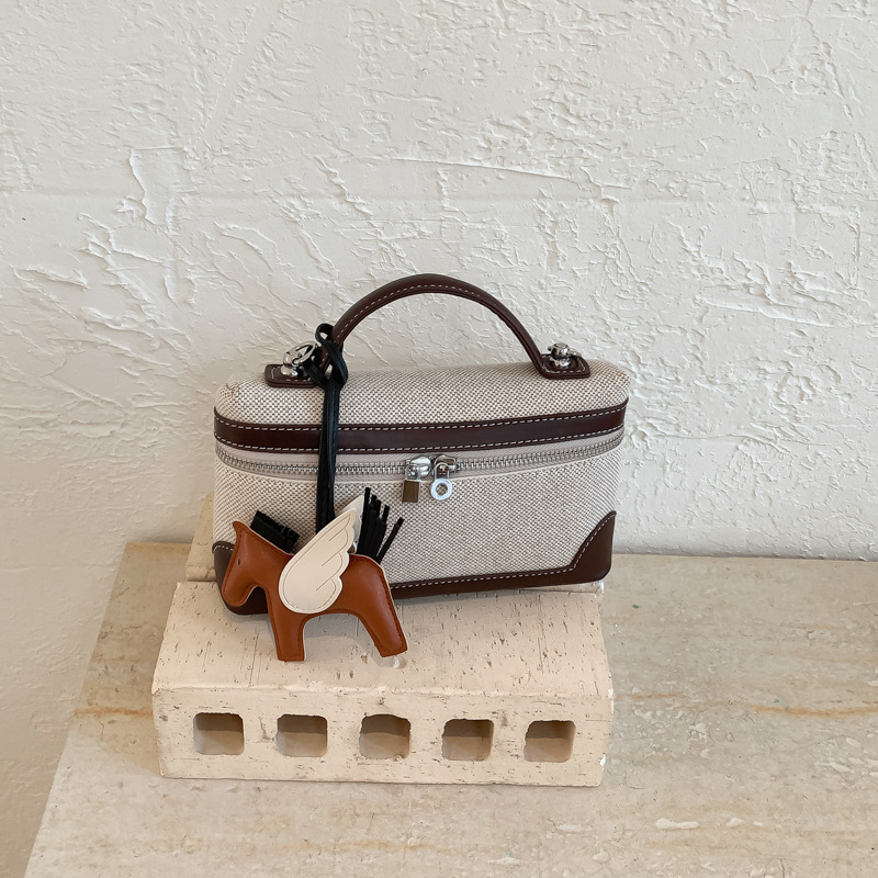 Bolso de mano de alta sensación 2026 nuevo lienzo de moda bolso de color pequeño bolso cuadrado de viaje bolsa de mochila ocio