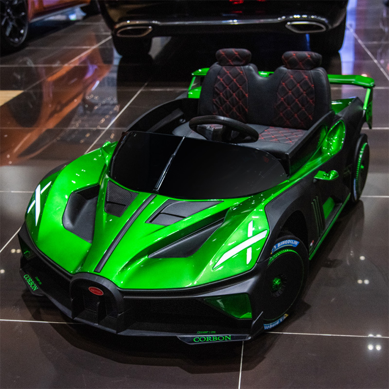 Coche eléctrico para niños coche de control remoto sentado bebé coche deportivo de cuatro ruedas entrega de una pieza coche de juguete recargable