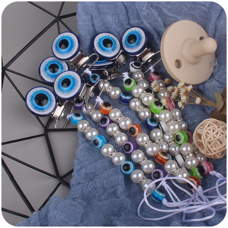 Suministros para bebés chupete de acrílico cadena anti-gota ojos azules bebé chupete clip chupete cadena Amazon nuevo