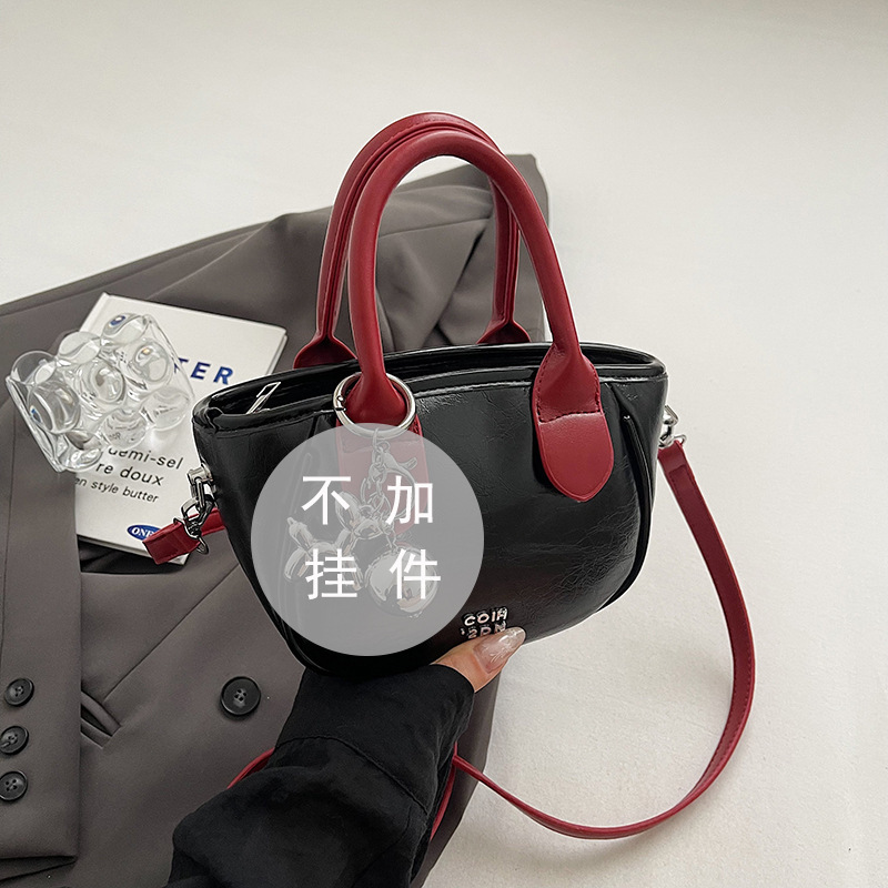 Alta sensación de contraste bolsos pequeños para mujeres 2024 nuevo verano popular bolsa de mensajero versátil Super Fire bolsa de cubo de mano