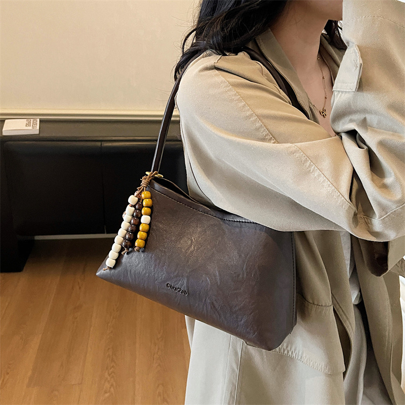 Bolsas transfronterizas para mujeres 2025, otoño y invierno, nuevo bolso coreano, bolso de brazo retro, bolso de hombro simple de moda para mujeres.