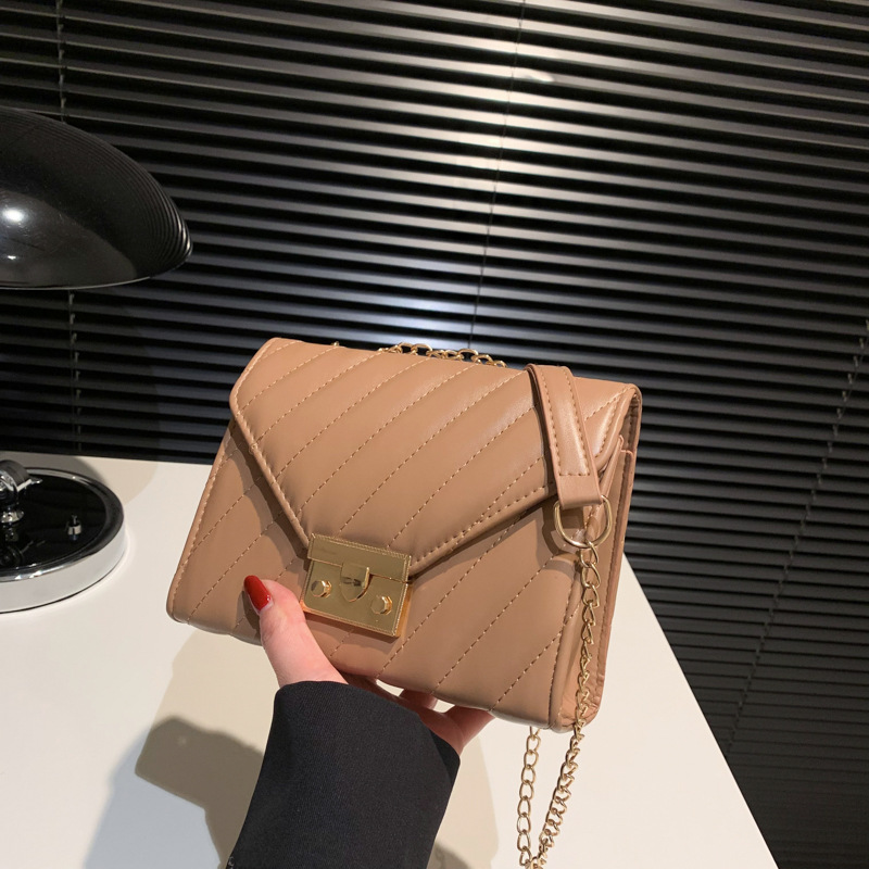Bolso de costura de automóvil para mujeres fresco estilo exterior bolso de color sólido 2025 moda nueva bolsa de cinturón de cerradura de primavera