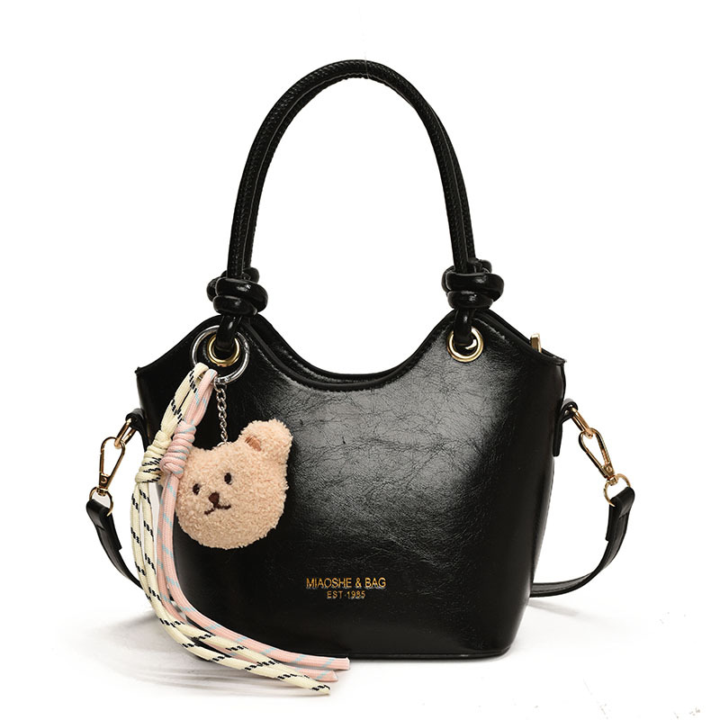 Popular ultra caliente bolso de cubo de mano para mujeres 2025 nuevo nicho Zhong universal bolso de viaje casual simple mochila de hombro