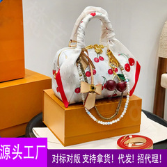 クロスボーダーハイエンドボストンバッグ女性用 2025 新しいハンドバッグカラープリント気質多用途シングルショルダークロスボディ