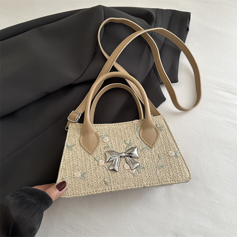 Moda de tejido de paja de primavera y verano 2025 nueva tendencia de encaje de paja estilo occidental bolso de mensajero de un solo hombro femenino