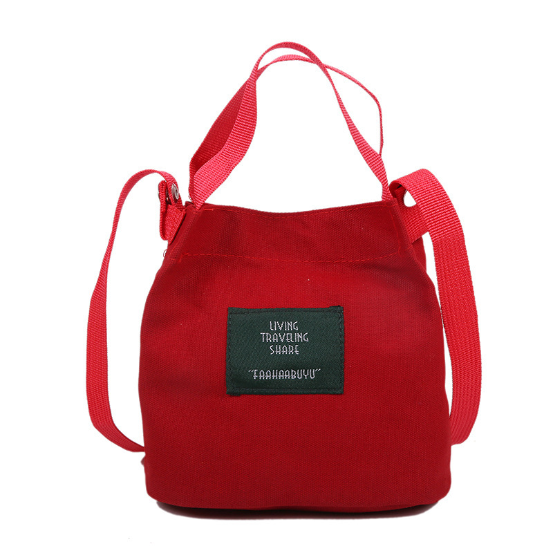 Bolso de mujer nuevo estilo coreano simple bolso de lienzo de chicas fresco de color sólido bolso de cubo de moda moda bolsa de mochila casual