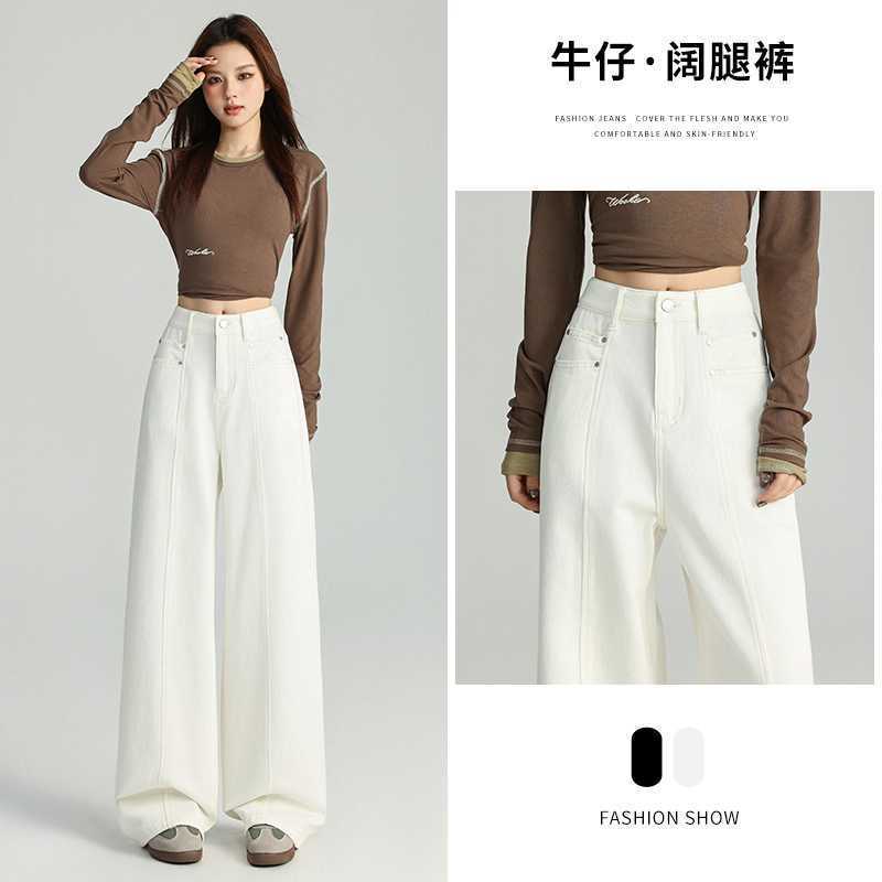 春と秋のカレー色のストレートジーンズの女性のゆったりとしたレトロなハイウエストはやせています。|undefined