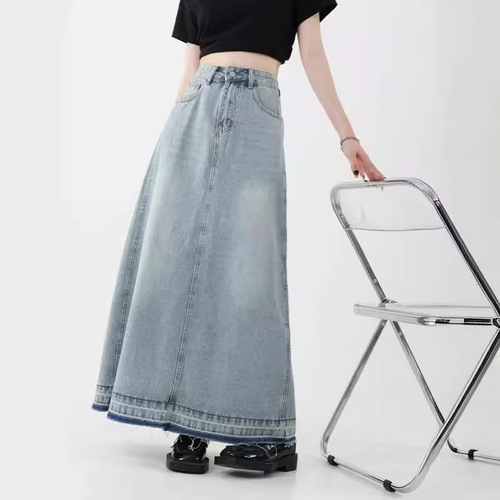 Vintage American design flared denim skirt for women, mini length, featuring frayed edges, high-waisted for a slimming effect, A-line style, suitable for spring.