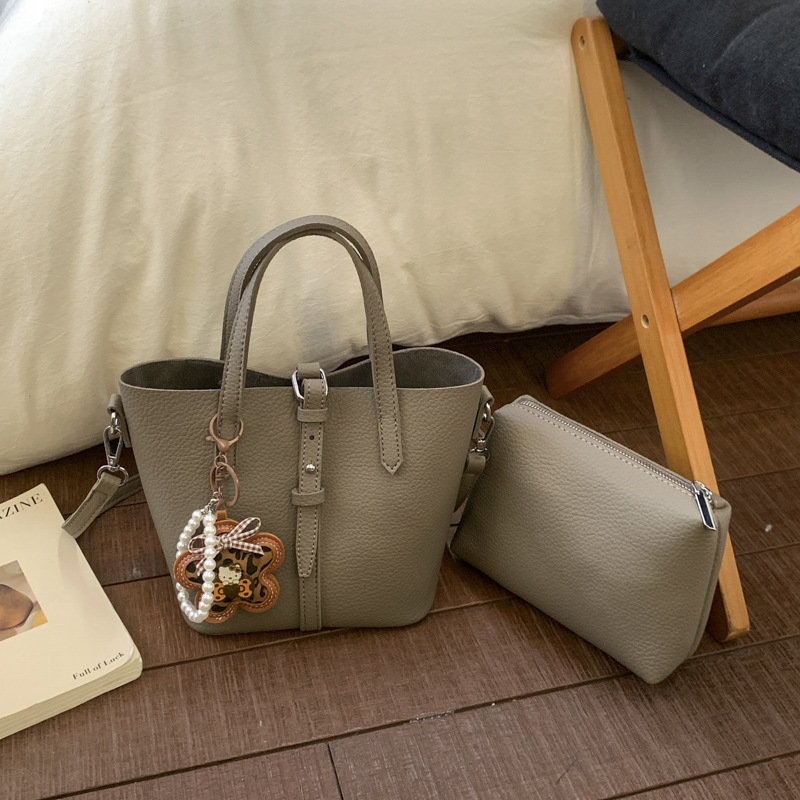 Nicho coreano canasta de platos portátiles bolsos de cubo para mujeres 2026 ventas calientes nuevas bolsas de hombro casuales de gran capacidad