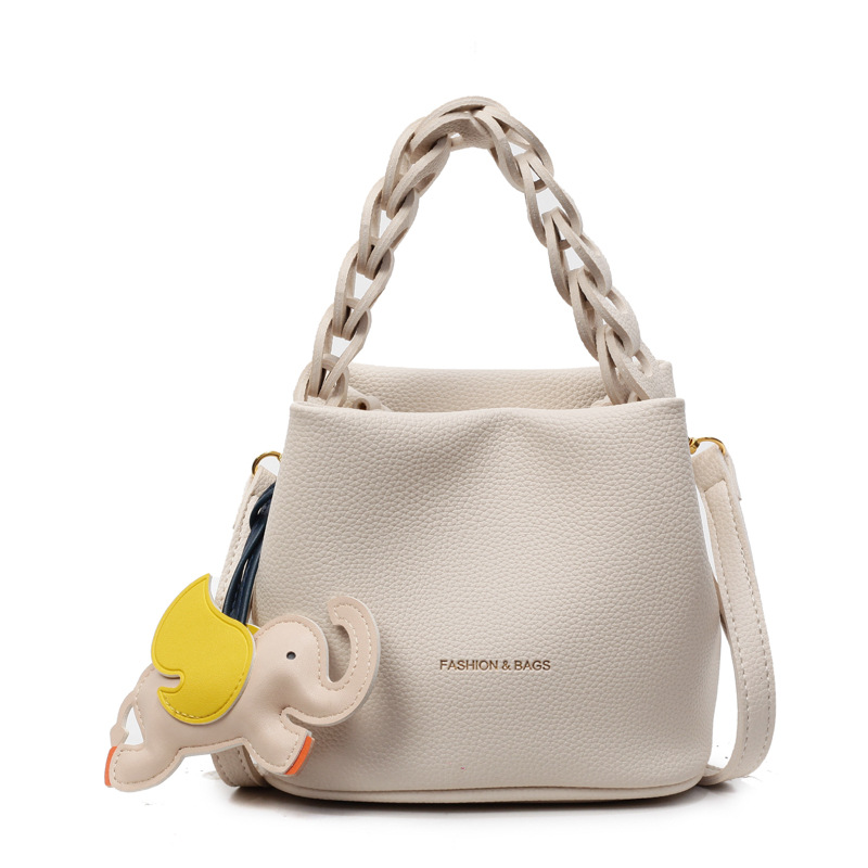 Bolso pequeño portátil de textura de alta calidad para mujer 2025 nuevo bolso de cubo de cuero suave de moda bolso de mensajero de hombro casual de todo fósforo