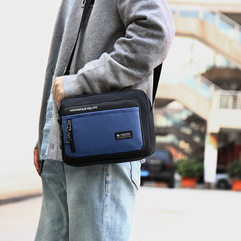 Bolso de hombro casual de gran capacidad para hombres, nuevo bolso de mensajero ligero y simple de comercio exterior, maletín portátil para viajes de negocios