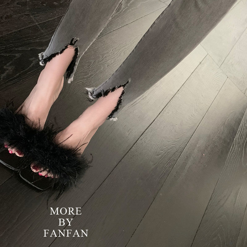 Sandalias europeas y americanas 2025 primavera y verano nuevo estilo pavo lana dama moda lana pelo hada tacones altos zapatos de lana de avestruz