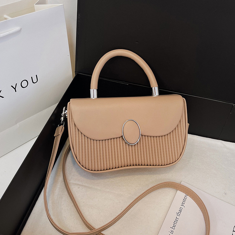 Versión coreana del bolso de nicho 2025 verano nuevo bolso femenino de alta calidad textura bolso de hombro moda bolso de mensajero a rayas marea