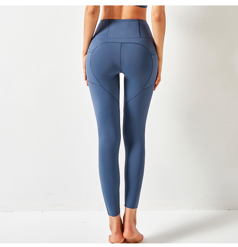 Pantalones de yoga de color sólido con bolsillos de cintura alta y cintura alta que levantan la cadera NSYWH127911