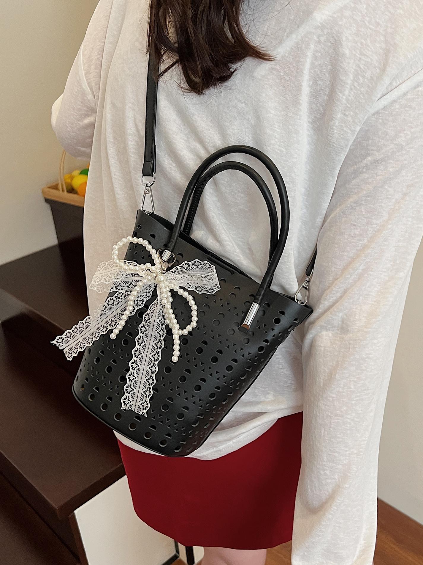 Bolsa de balde hueca de verano para mujeres 2025 nuevo nicho de moda versátil bolso de hombro bolsa de tendencia casual