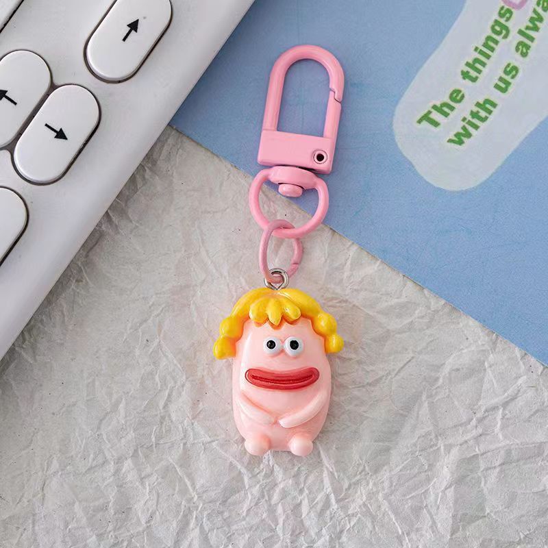 Bonita boca grande extraña llavero salchicha colgante estudiante pequeño libro rojo con accesorios colgante de color para amigos regalos