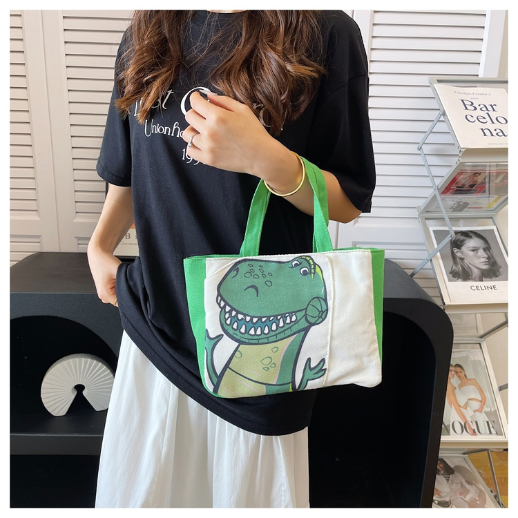 Cute cartoon printed small bag, 2024 summer new style hand-held piggy girl handbag, student storage canvas bag undefined