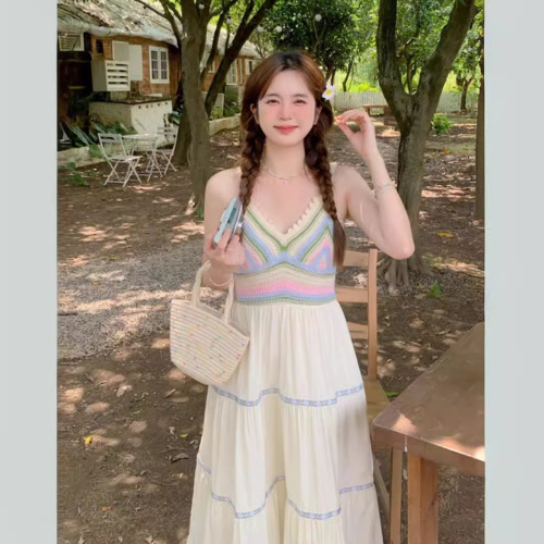 Retro ethnic-style designer V-neck knitted sweater with patchwork, paired with a long beach-style slip dress—women's clothing.