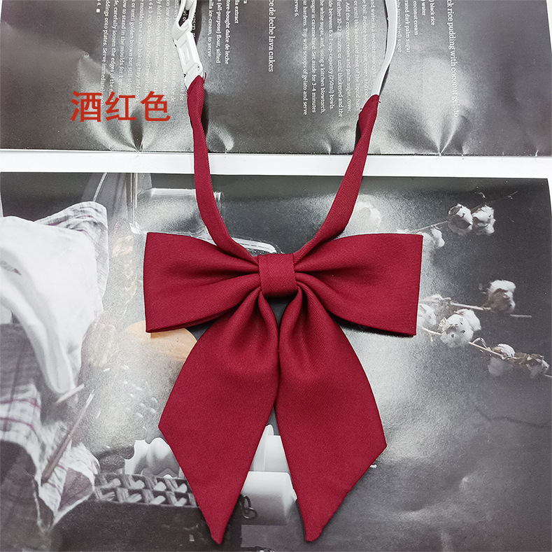 Spot al por mayor versión estrecha niña pequeña pajarita de raíz de plumas pajarita flor moda nuevo lazo color sólido jk pajarita satinado