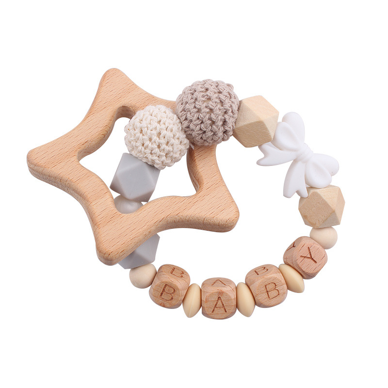 Nuevos productos para bebés abrazaderas de abrazaderas de haz de dibujos animados DIY pulsera de dientes molares decoración colgante de campana cuatro piezas