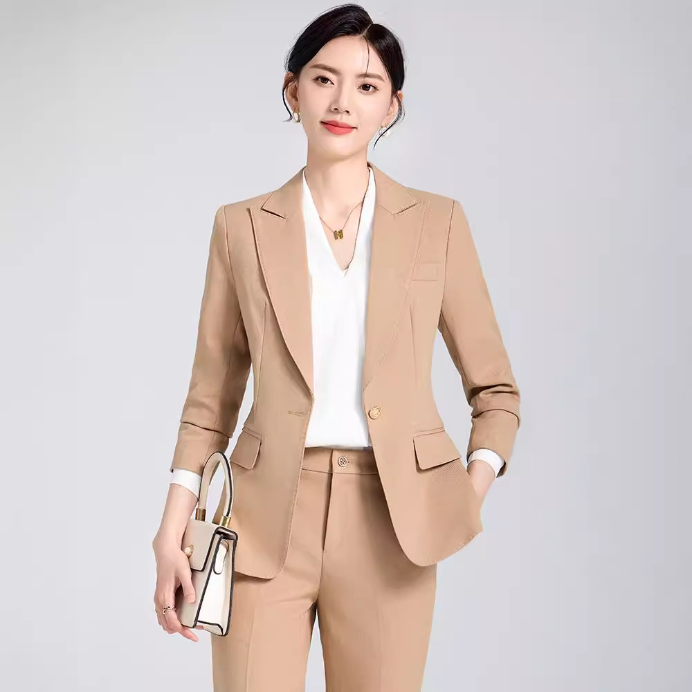 Woman wearing longline vest over fitted turtleneck for office