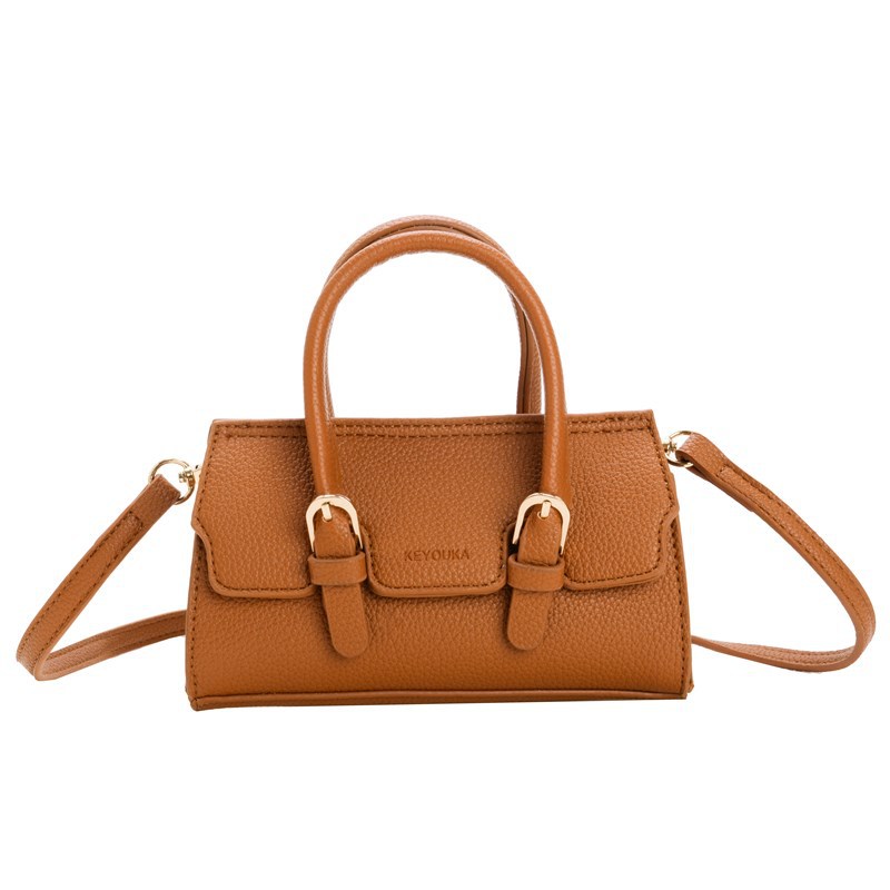 Bolso de hombro para niños y niñas de moda coreana, mini bolso de bebé de color sólido simple, nuevo bolso para niños de comercio exterior