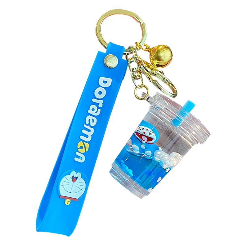 Doraemon Quicksand llavero femenino lindo estudiante niños mochila colgante coche llavero pareja pequeña joyería