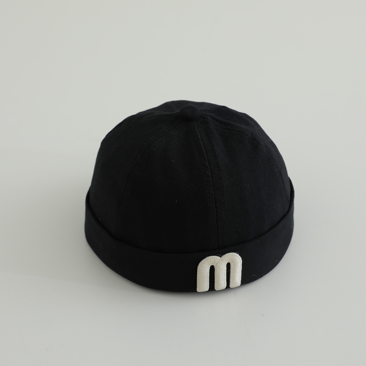 letras coreanas m niños terratenientes sombrero primavera y otoño modelado cóncavo de moda para hombres y mujeres bebés sombrero de tela de color sólido