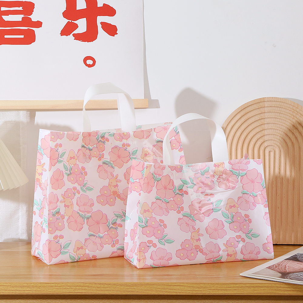 Bolsas de regalo de plástico personalizadas impresión logotipo bolsas de ropa personalizadas bolsas de goma de compras ropa de mujer portátil