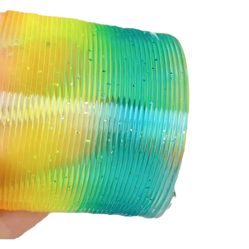 Juguete para niños anillo de arco iris elástico al por mayor primavera educativa anillo apilado gran cristal mezclado descompresión del cabello tienda departamental