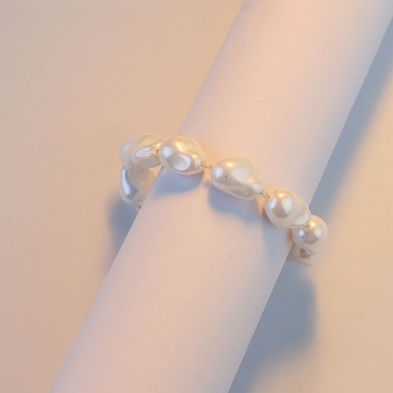 Nuevos productos de alto nivel imitación barroco pulsera de perlas nicho diseño ligero lujoso flujo de cuentas pulsera de pulsera de absorción magnética exquisita