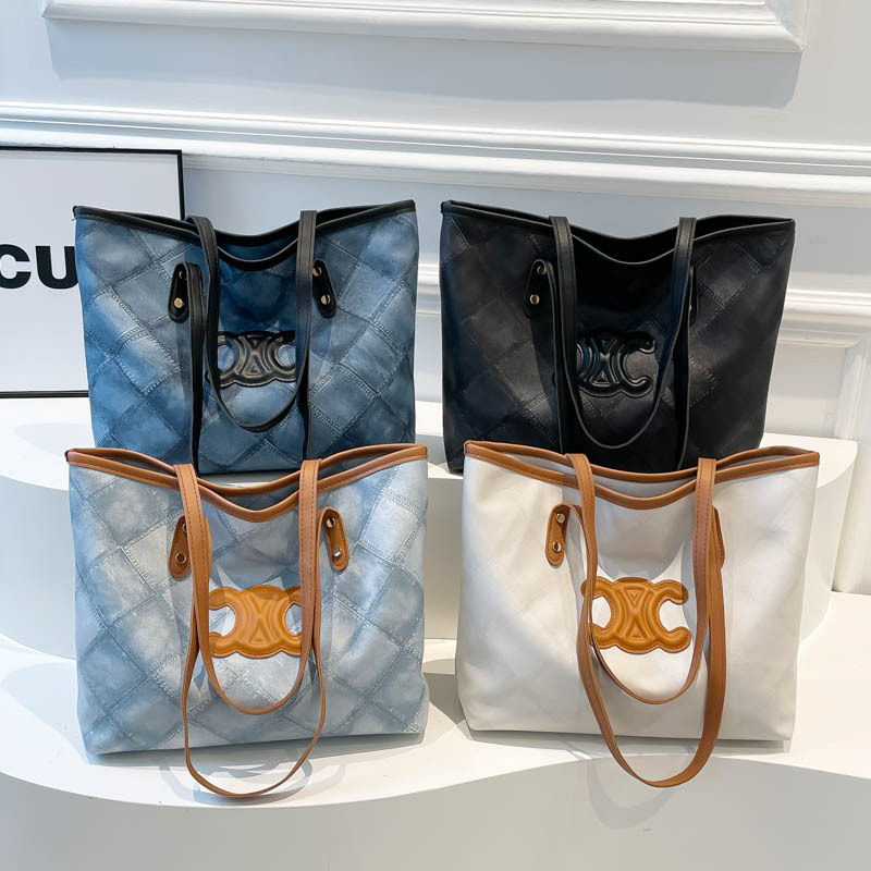 Bolsa de mano transfronteriza de gran capacidad para mujeres 2025, nueva sensación de alta calidad, bolso de hombro de viaje universal, bolso de moda