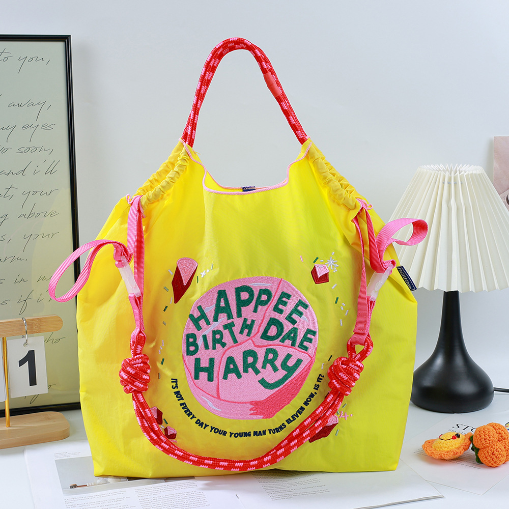 Bright yellow birthday cake + pink shoulder strap